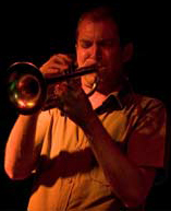 Mat Jodrell playing trumpet at a jam session.