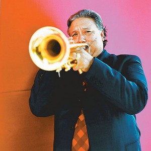 Arturo Sandoval holding a trumpet.